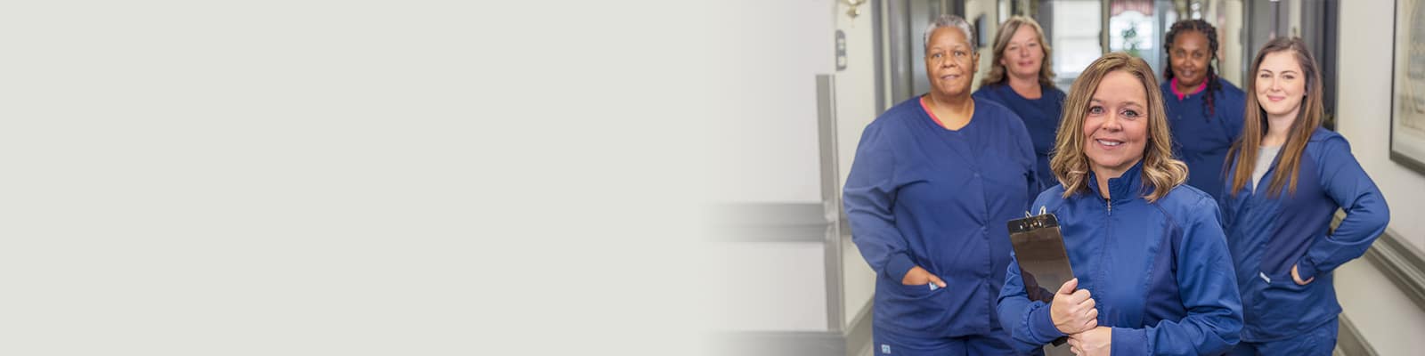 Nurses standing in the hallway at Delhi Post Acute